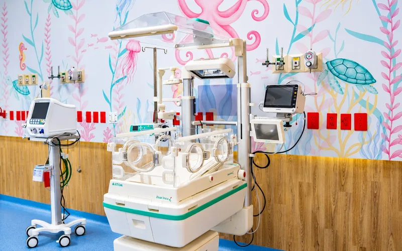 Incubator with a monitor and ventilator in the Neonatal Intensive Care Unit